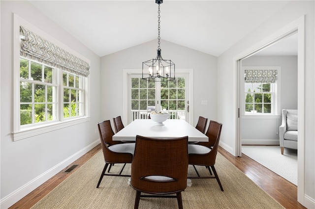 10 Linden Gate Ln, Newport, RI 02840 - dining area featuring a chandelier, wood finished floors, and vaulted ceiling