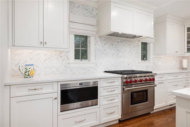 10 Linden Gate Ln, Newport, RI 02840 - kitchen featuring designer stove, custom range hood, light countertops, backsplash, and white cabinets