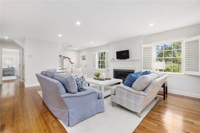 10 Linden Gate Ln, Newport, RI 02840 - living room featuring stairs, a fireplace, light wood-style floors, and recessed lighting