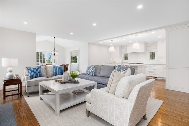 10 Linden Gate Ln, Newport, RI 02840 - living area with light wood finished floors, a chandelier, recessed lighting, and lofted ceiling