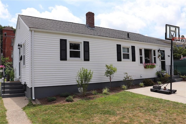 10 Park Way, Lincoln, RI 02838 - view of home's exterior with a chimney and a lawn