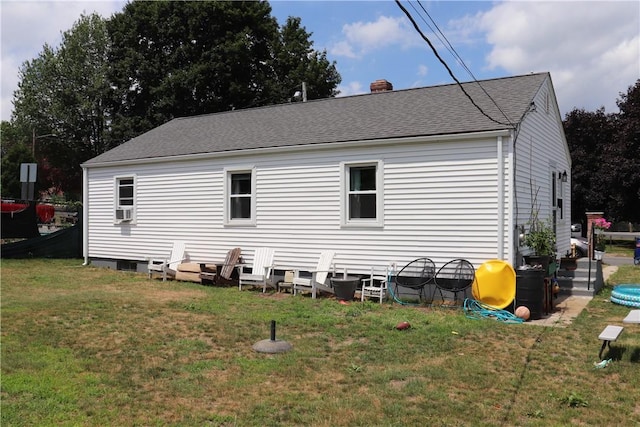 10 Park Way, Lincoln, RI 02838 - rear view of house featuring a lawn, a chimney, roof with shingles, and cooling unit