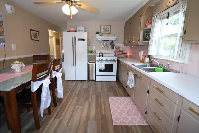 10 Park Way, Lincoln, RI 02838 - kitchen featuring white appliances, light wood-type flooring, light countertops, under cabinet range hood, and ceiling fan