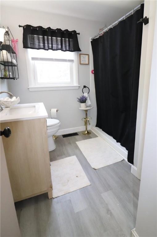 10 Park Way, Lincoln, RI 02838 - full bathroom featuring wood finished floors, vanity, and a shower with curtain