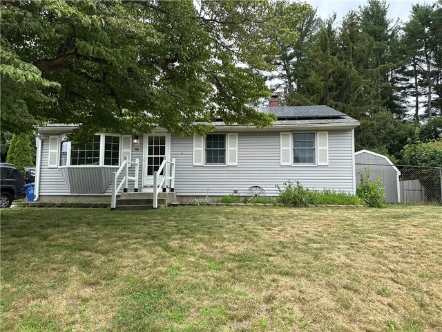 55 Circle Dr, Mansfield, CT 06250 - ranch-style house featuring solar panels and a chimney