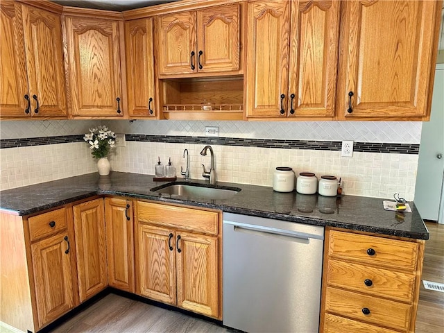 55 Circle Dr, Mansfield, CT 06250 - kitchen with dishwasher, light wood finished floors, decorative backsplash, and dark stone countertops