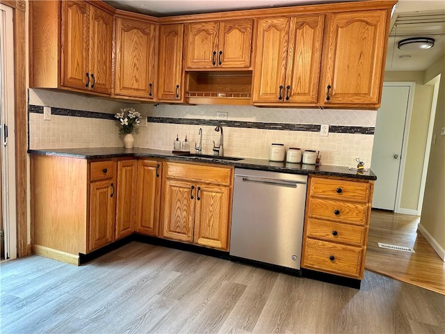 55 Circle Dr, Mansfield, CT 06250 - kitchen with dishwasher, light wood-type flooring, tasteful backsplash, and brown cabinetry