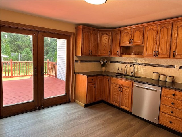 55 Circle Dr, Mansfield, CT 06250 - kitchen featuring dishwasher, dark countertops, tasteful backsplash, and brown cabinetry