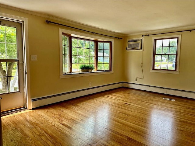55 Circle Dr, Mansfield, CT 06250 - unfurnished room with ornamental molding, hardwood / wood-style flooring, baseboard heating, and a wall mounted air conditioner