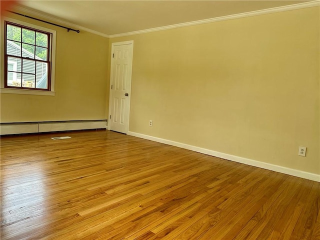 55 Circle Dr, Mansfield, CT 06250 - spare room featuring a baseboard heating unit, crown molding, and hardwood / wood-style flooring