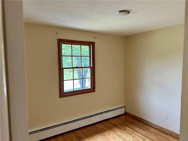 55 Circle Dr, Mansfield, CT 06250 - unfurnished room featuring a baseboard heating unit and light wood-type flooring