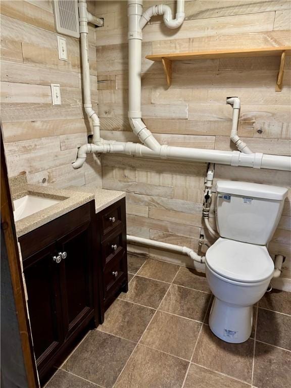 55 Circle Dr, Mansfield, CT 06250 - bathroom featuring vanity and wooden walls