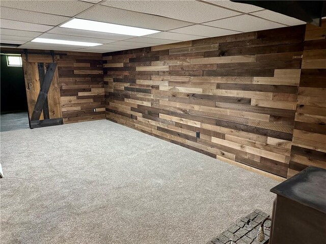 55 Circle Dr, Mansfield, CT 06250 - finished basement featuring wood walls, carpet flooring, and a paneled ceiling