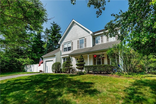 50 S Pond Dr, Coventry, RI 02816 - view of front facade with covered porch, a garage, and driveway