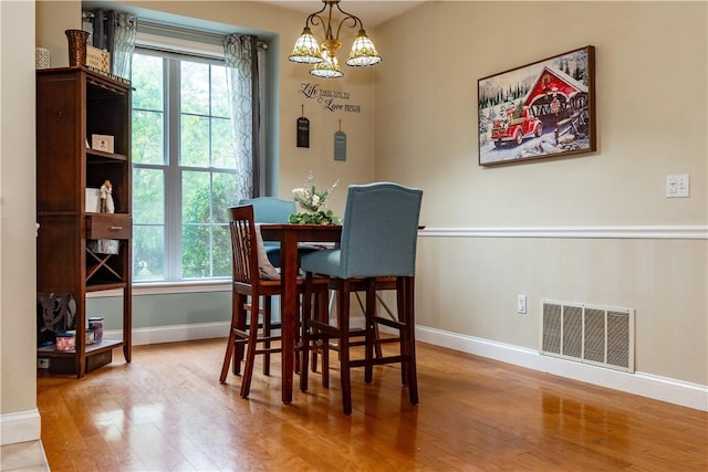 50 S Pond Dr, Coventry, RI 02816 - dining area with wood finished floors and a chandelier