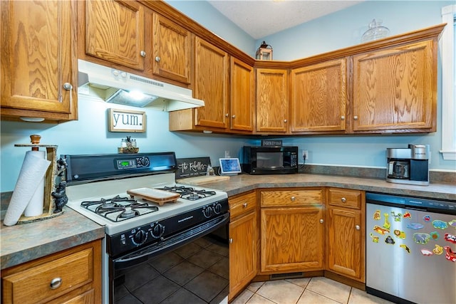 50 S Pond Dr, Coventry, RI 02816 - kitchen featuring gas stove, under cabinet range hood, dishwasher, black microwave, and light tile patterned flooring