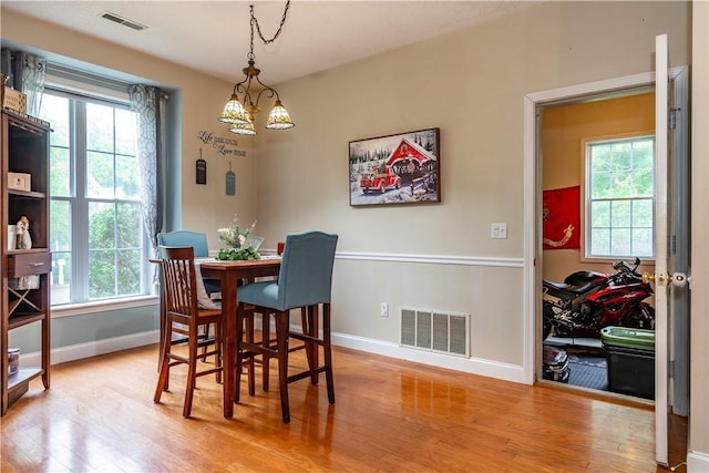 50 S Pond Dr, Coventry, RI 02816 - dining room with light wood finished floors and a chandelier