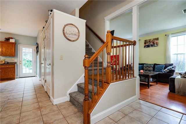 50 S Pond Dr, Coventry, RI 02816 - stairway featuring tile patterned floors and baseboards