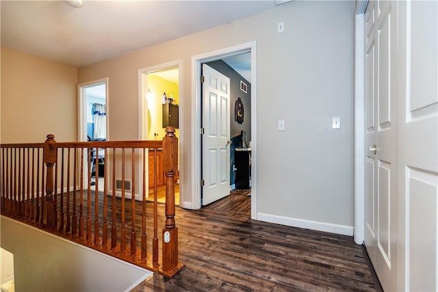 50 S Pond Dr, Coventry, RI 02816 - hall featuring dark wood finished floors and an upstairs landing