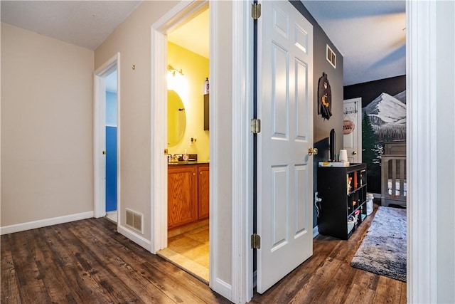 50 S Pond Dr, Coventry, RI 02816 - hallway featuring dark wood-style flooring and baseboards