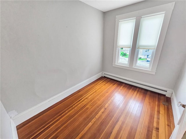 156 Broad St, Burrillville, RI 02859 - unfurnished room featuring baseboard heating and wood-type flooring