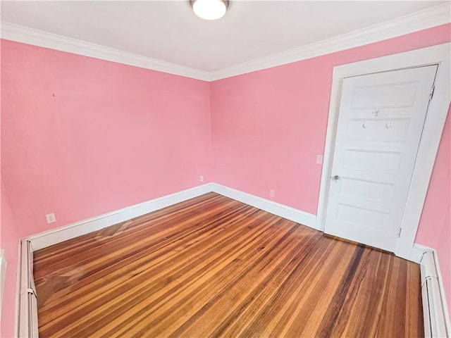 156 Broad St, Burrillville, RI 02859 - spare room with a baseboard heating unit, wood finished floors, and ornamental molding