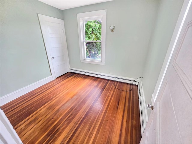 156 Broad St, Burrillville, RI 02859 - spare room with a baseboard radiator and wood finished floors