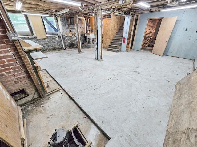 156 Broad St, Burrillville, RI 02859 - basement with stairway and a sink