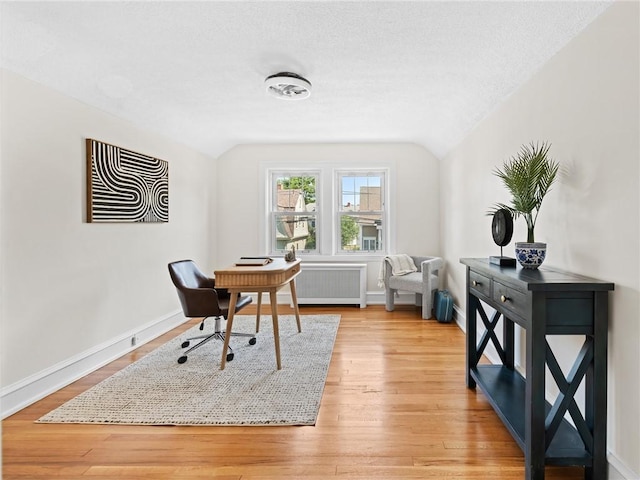 155 Hillside Ave, Providence, RI 02906 - office with radiator heating unit, light wood-style floors, lofted ceiling, and a textured ceiling