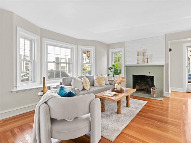 155 Hillside Ave, Providence, RI 02906 - living area featuring light wood-style floors and a brick fireplace