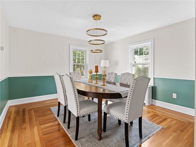 155 Hillside Ave, Providence, RI 02906 - dining room with a chandelier and light wood-style flooring