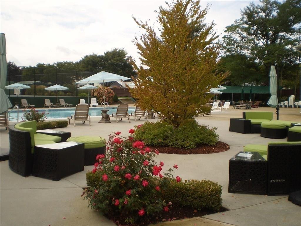 103 Edaville Ct Unit 103, Warwick, RI 02886 - view of community featuring a swimming pool and a patio area