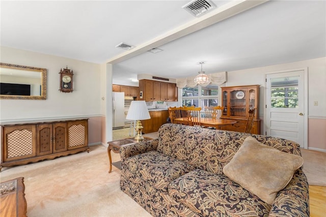 185 Sunnybrook Dr, North Kingstown, RI 02852 - living area with a chandelier and light carpet