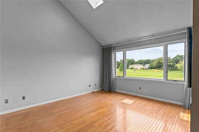 76 Valley Green Ct Unit B, North Providence, RI 02904 - empty room with light wood finished floors, lofted ceiling, and a skylight