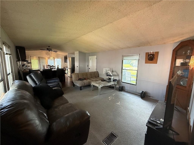 225 Brayton Ave, Tiverton, RI 02878 - living room featuring a textured ceiling, carpet floors, plenty of natural light, lofted ceiling, and a ceiling fan