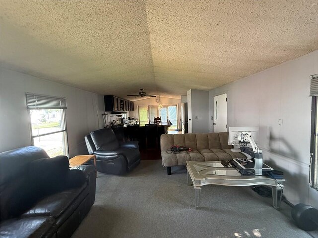 225 Brayton Ave, Tiverton, RI 02878 - carpeted living room featuring lofted ceiling, a textured ceiling, and ceiling fan