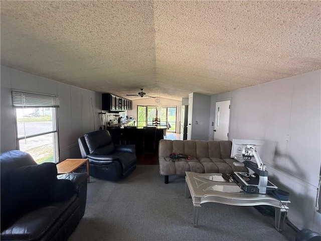225 Brayton Ave, Tiverton, RI 02878 - carpeted living area with a textured ceiling, healthy amount of natural light, a ceiling fan, and lofted ceiling
