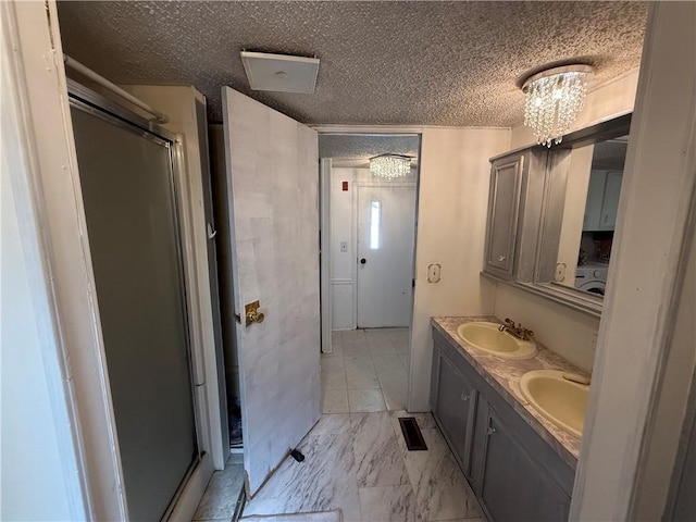 225 Brayton Ave, Tiverton, RI 02878 - full bath with a textured ceiling, a shower stall, double vanity, marble look tile flooring, and a chandelier