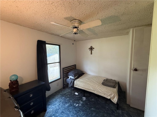 225 Brayton Ave, Tiverton, RI 02878 - unfurnished bedroom with a textured ceiling, dark carpet, and a ceiling fan