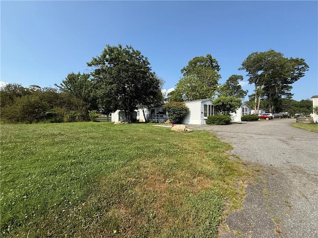 225 Brayton Ave, Tiverton, RI 02878 - view of front of property featuring asphalt driveway and a front yard