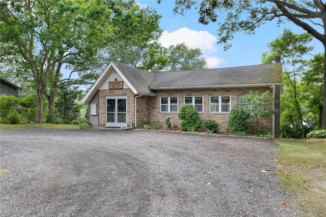 50 Betony Rd, Narragansett, RI 02874 - view of front of house with a chimney, french doors, stone siding, and a shingled roof
