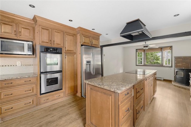 50 Betony Rd, Narragansett, RI 02874 - kitchen with appliances with stainless steel finishes, island range hood, light wood-style floors, decorative backsplash, and a kitchen island