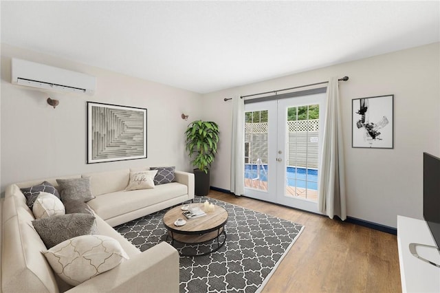 50 Betony Rd, Narragansett, RI 02874 - living area with a wall mounted air conditioner, wood finished floors, and french doors