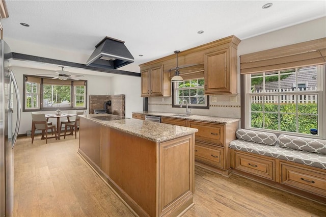 50 Betony Rd, Narragansett, RI 02874 - kitchen featuring appliances with stainless steel finishes, a center island, decorative backsplash, light wood-type flooring, and recessed lighting