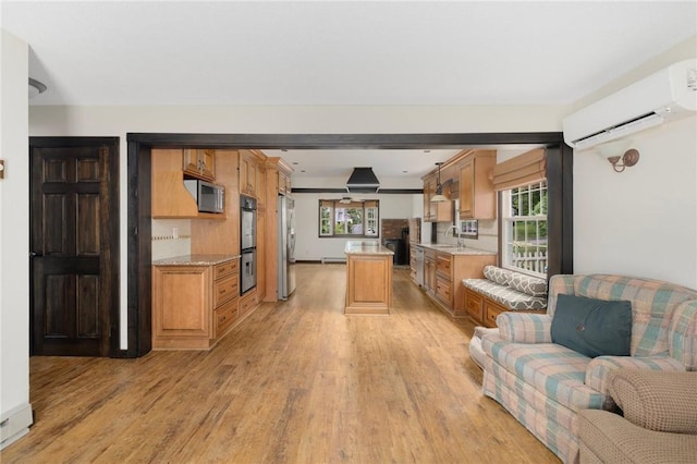 50 Betony Rd, Narragansett, RI 02874 - living room featuring a wall mounted AC, light wood-style flooring, plenty of natural light, and a baseboard radiator