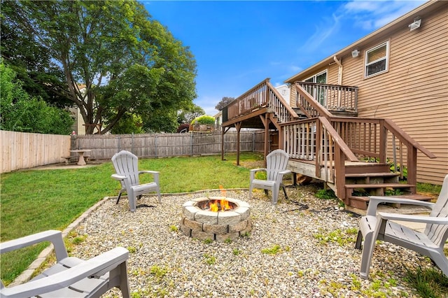 59 Columbus Ave, North Providence, RI 02911 - fenced backyard with a fire pit, stairway, and a wooden deck