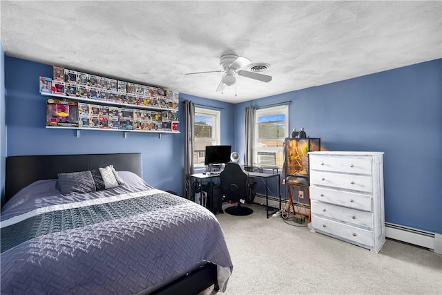 59 Columbus Ave, North Providence, RI 02911 - carpeted bedroom featuring baseboard heating, a ceiling fan, a baseboard heating unit, cooling unit, and a textured ceiling