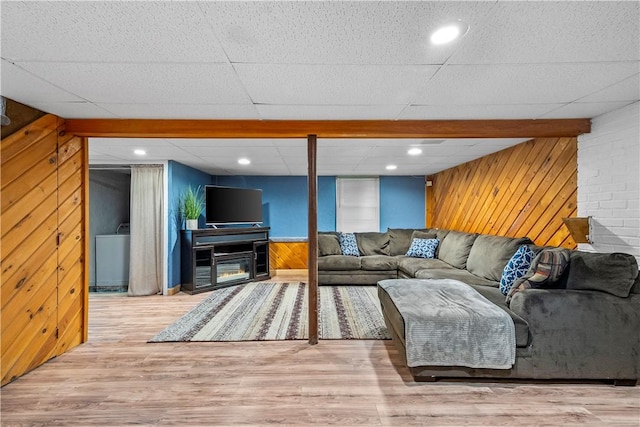 59 Columbus Ave, North Providence, RI 02911 - living area with wood walls, washer / clothes dryer, and wood finished floors