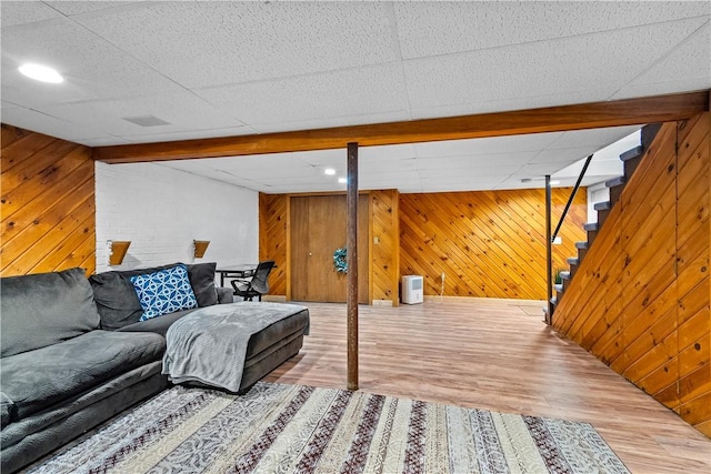 59 Columbus Ave, North Providence, RI 02911 - living room with wood finished floors, wood walls, stairway, and beamed ceiling