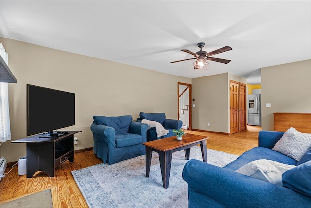 140 Long Hwy, Little Compton, RI 02837 - living room featuring stairs, light wood-style floors, and a ceiling fan